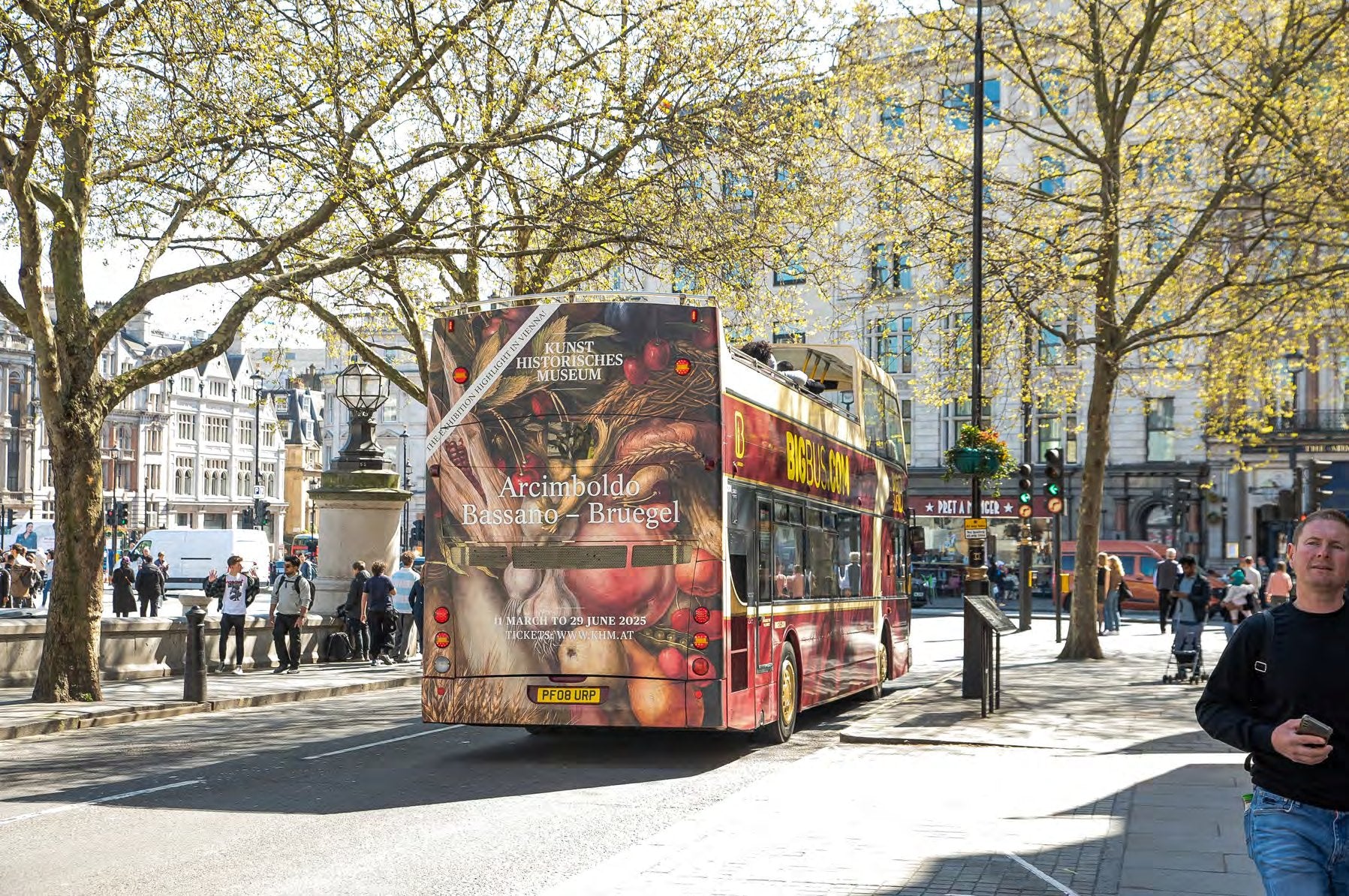 Rear advertising panel on an open-top tourist bus in London