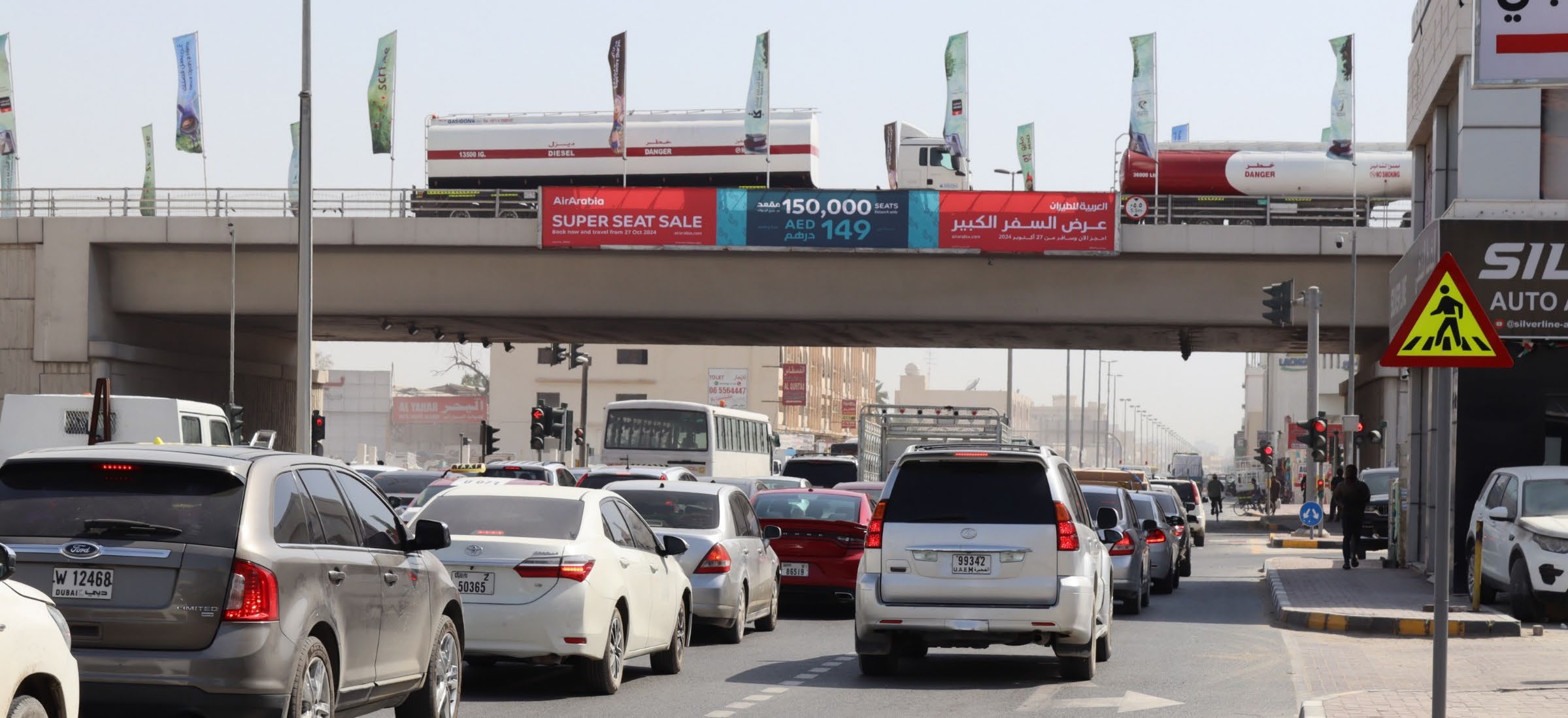 Backlit bridge banner over First Industrial Street, Sharjah